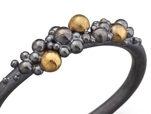 women´s silverring with silver and gold pearls
